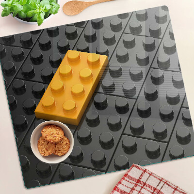 Staklena daska za rezanje LEGO kockice na crnoj pozadini