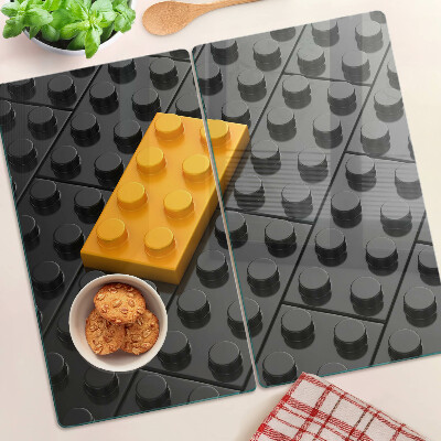 Staklena daska za rezanje LEGO kockice na crnoj pozadini