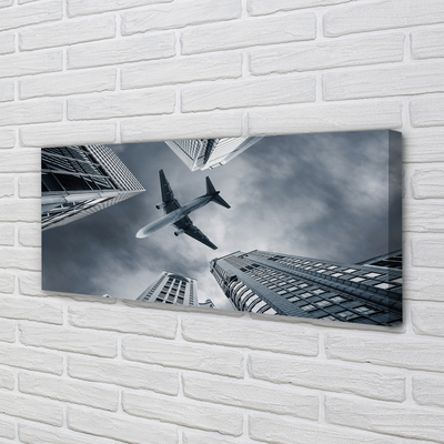 Fotografija na canvas platnu Grad oblaci avion nebo