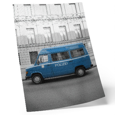 Plakat Plavi policijski automobil sa zgradom u pozadini