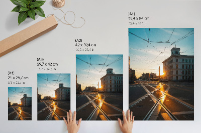 Plakat Zalazeće sunce nad gradom s arhitekturom