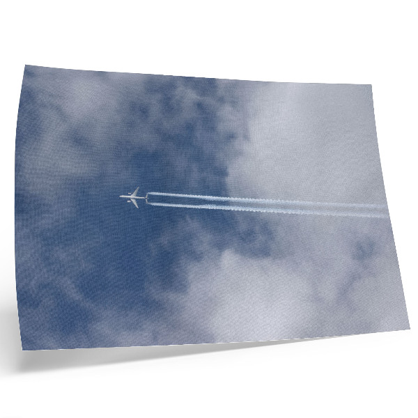 Plakat na platnu Avion na plavom nebu s bijelim prugama