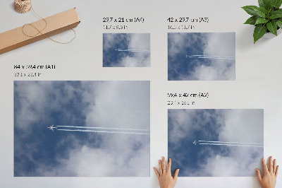 Plakat na platnu Avion na plavom nebu s bijelim prugama